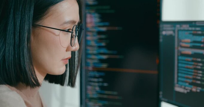 Closeup young adult Asia female freelance eyeglasses typing write prompt AI bot IT app program nomad, video game, terminal with coding, user interface, designer, big data center on desktop computer.