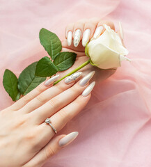 Female Hands with beautiful pearl manicure