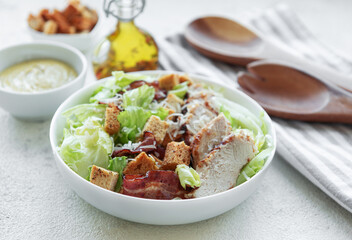 A bowl  of  Caesar salad