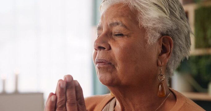 Senior woman, prayer hands and faith in home with worship, thanks and connection to God in retirement. Elderly person, religion and peace in morning with gratitude, reflection and trust in apartment
