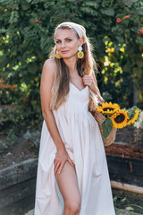 photo in Italian style with a sexy young woman in a light summer dress a peasant woman picking fruits