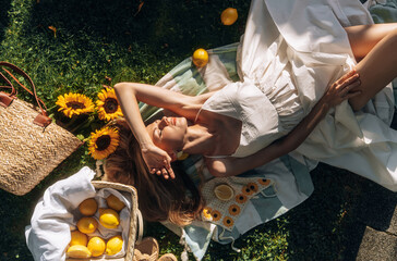 photo in Italian style with a sexy young woman in a light summer dress a peasant woman picking...