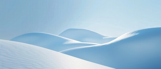 A snowy mountain range with a blue sky in the background