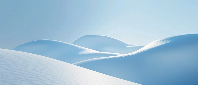 A snowy mountain range with a blue sky in the background