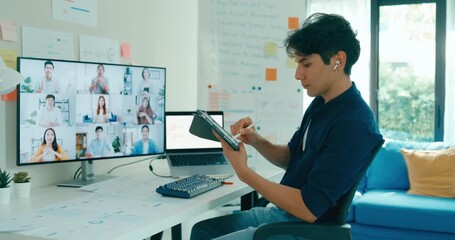 Young freelance Asia male use laptop talk to colleague plan in video call meeting on desk in living room at home office. Work from house, financial plan, remotely digital nomad job and Gen Z talent.