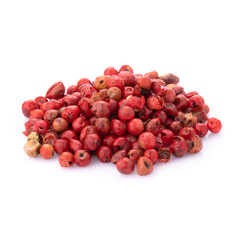Pink peppercorns seeds isolated on white background.