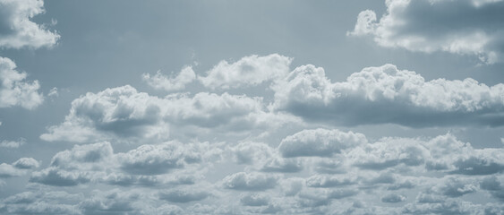 Dramatic overcast sky with gray clouds forming moody and tranquil backdrop before rain, capturing the serene yet stormy atmosphere in the cloudy weather of the rainy season. Moody and peaceful scene.