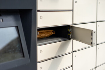 The parcel in paper packaging lies in the parcel locker
