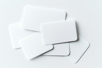 Blank business cards stacked on a white background with ample copy space for customization, top view of clean and professional design template.