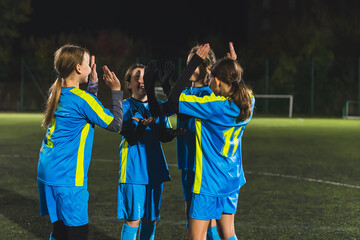 girls power and victory, teenage football player girls clapping and getting ready to play. High quality photo