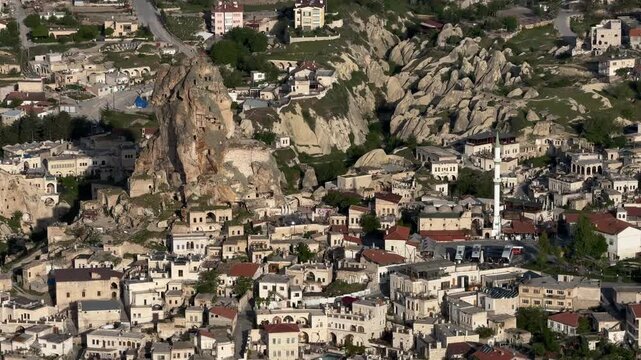 Aerial footage of the cityscape of Ortahisar on a sunny day in Nevsehir, Cappadocia, Turkey