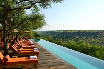 The main lodge pool and deck chairs are located in a private game reserve in Sabi Sabi