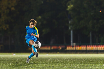Soccer girl playing game as a goalie. Youth female football team playing tournament match. High quality photo