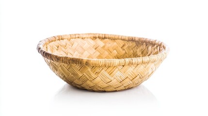 Fototapeta premium Southwestern native American design wicker basket with white background and spiral weave thick round cane