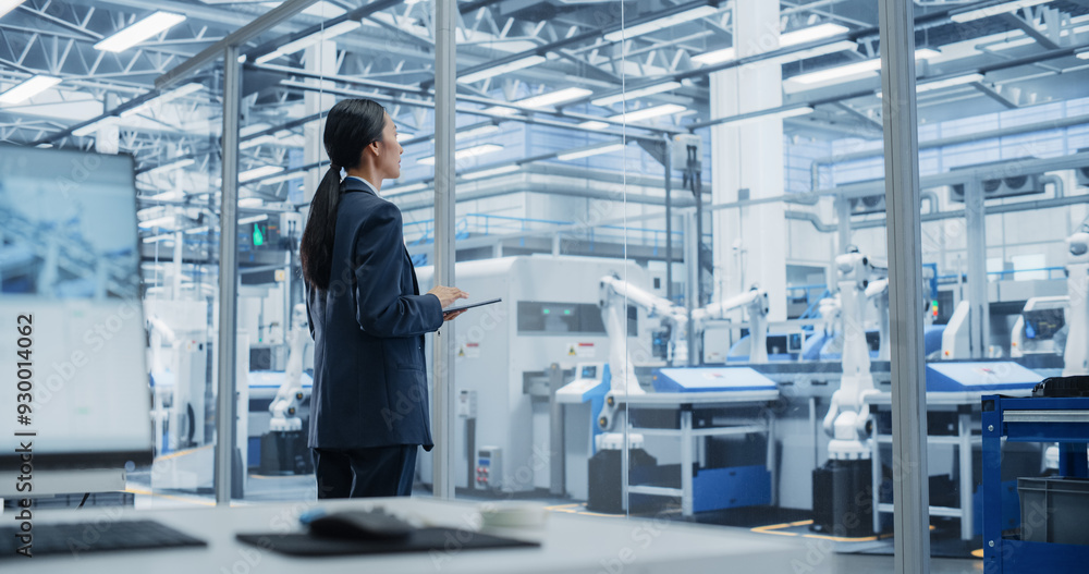 Aufkleber electronics manufacturing technician working on tablet computer at a factory space. asian female spe