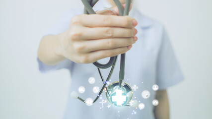 Doctor holding  stethoscope for medical and health care concept icon on global network connection, hospital, Service and Healthcare business.