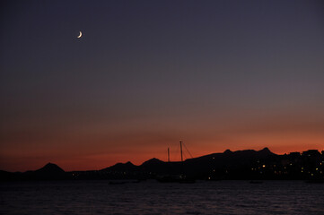 sunset with mountains and moon