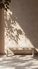 A minimalist wooden bench against a beige wall with delicate shadows of leaves and branches, creates a serene atmosphere for product photography
