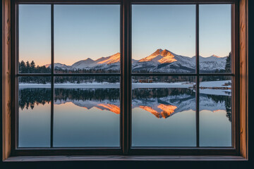 Snowy Mountains Reflected in a Lake Seen from a Lodge