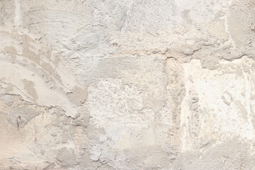 Texture of a wall with putty, concrete. Background of the exterior wall of a house during construction. Background of unfinished exterior gray wall
