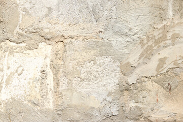 Texture of a wall with putty, concrete. Background of the exterior wall of a house during construction. Background of unfinished exterior gray wall