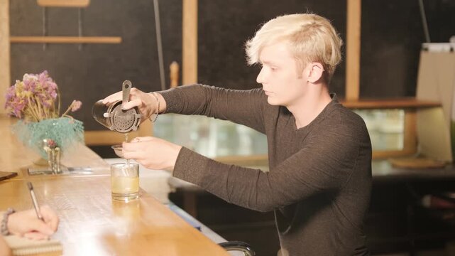 Bartender Preparing a Cocktail in a Bar