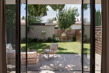 Rattan furniture in small but cozy garden