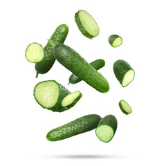 Many ripe cucumbers falling on white background
