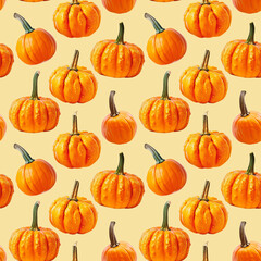 Seamless pattern of orange pumpkins on yellow background for Halloween or Thanksgiving day.