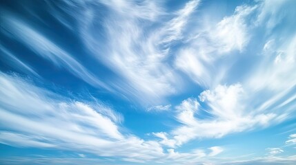 A view of clouds moving swiftly across the sky on a windy day.