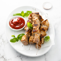 Traditional meat skewers with ketchup