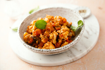 Homemade chicken ragout with tomato and spinach