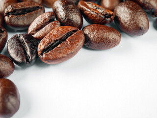 Coffee bean dark roasted seed on white background, Fresh roasted coffee beans isolated on white background.