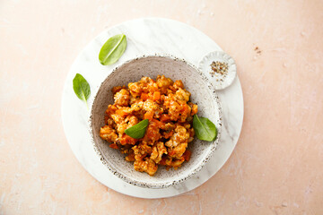 Homemade chicken ragout with tomato and spinach