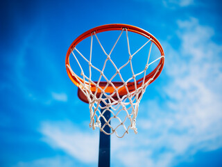 Basketball net set against a blue sky