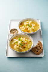 Homemade cauliflower soup with herbs