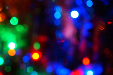 Christmas blurred background. A luminous Christmas tree garland. Christmas decorations.