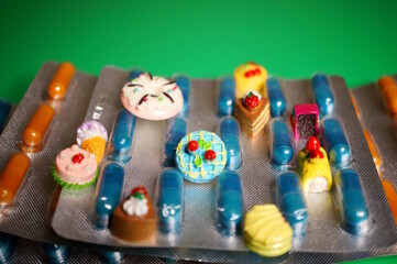 Packaging with dietary supplements and toy cakes.
