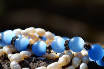 Jewelry. A cat's eye bracelet and pearls.