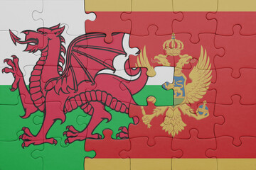 puzzle with the colourful national flag of montenegro and flag of wales .