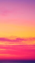 Obraz premium A vibrant sunset sky with shades of pink, orange, and yellow. The clouds create a beautiful pattern across the canvas.