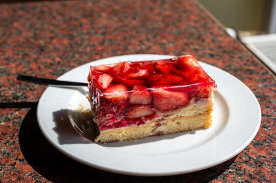 Strawberry cake or Erdbeerschnitte on a plate , Germany