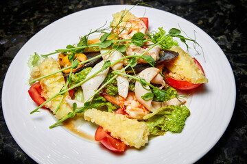 Mixed salad with seafood, tomato and Mozzarella cheese