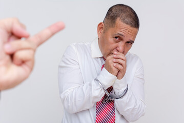 An anonymous victim gives the middle finger to an arrested man - a middle aged professional - who...