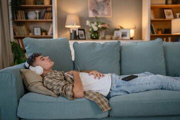 One teen man doing guided meditation yoga self care practice at home