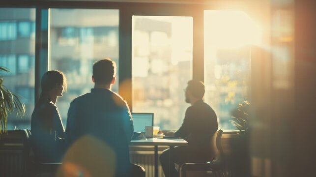 A team engages in a productive discussion in a bright office filled with natural light