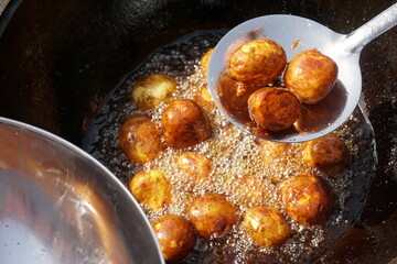 Organic new potatoes fried. Closeup photo of roasted potatoes