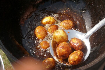 Organic new potatoes fried. Closeup photo of roasted potatoes