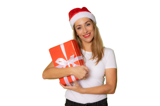 Portrait of young woman in Christmas hat with a gift in her hands posing isolated over transparent background.