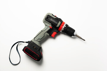 Drilling equipment, electric tool drill, cordless screwdriver. Working industrial power tool, screwdriver on white background